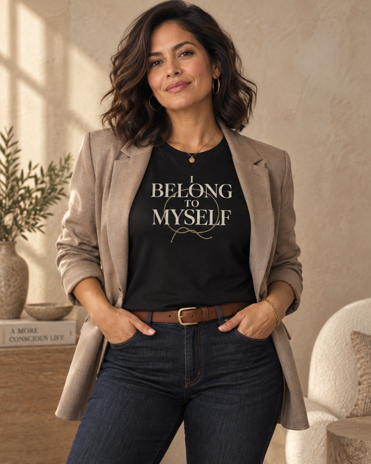 Woman wearing the I Belong to Myself black relaxed T-shirt with a neutral blazer.